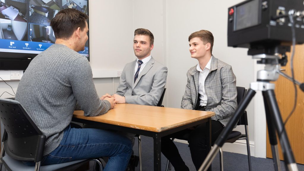 Students hone their interrogation skills in the EHU Police Training and Simulation Facility.
