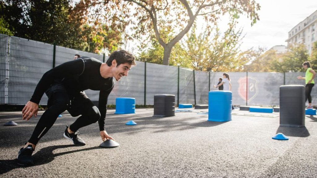 A man working out outside in the sunshine
