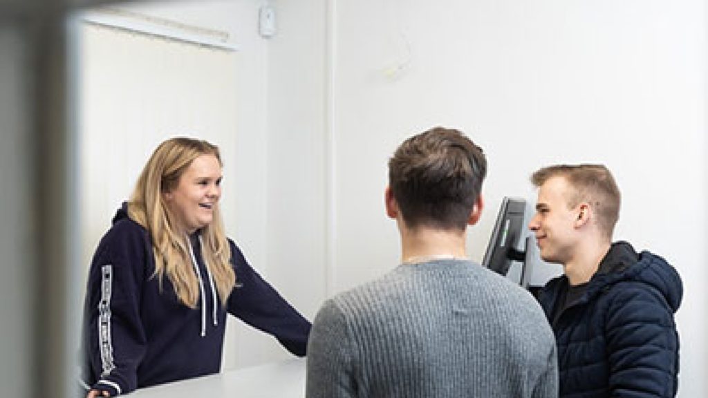 Three students in the police simulation centre.