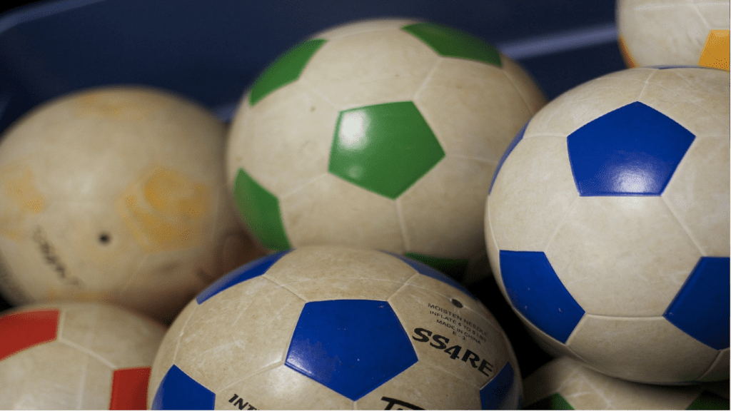 A pile of footballs.