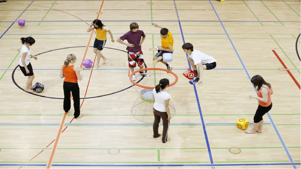 An image of a group of people playing a game with balls.
