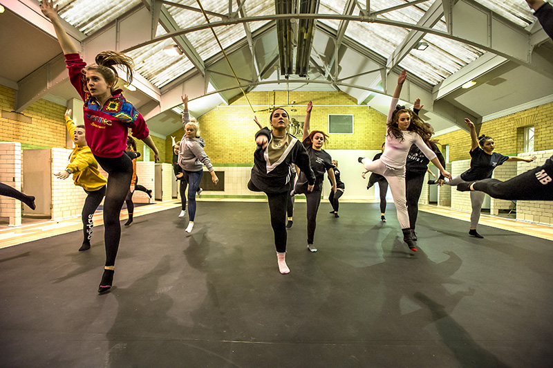 Dancers performing in old pool space