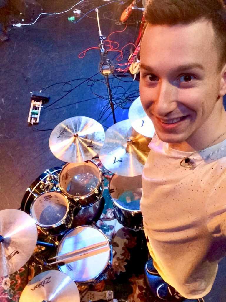 Jan standing over his drumkit