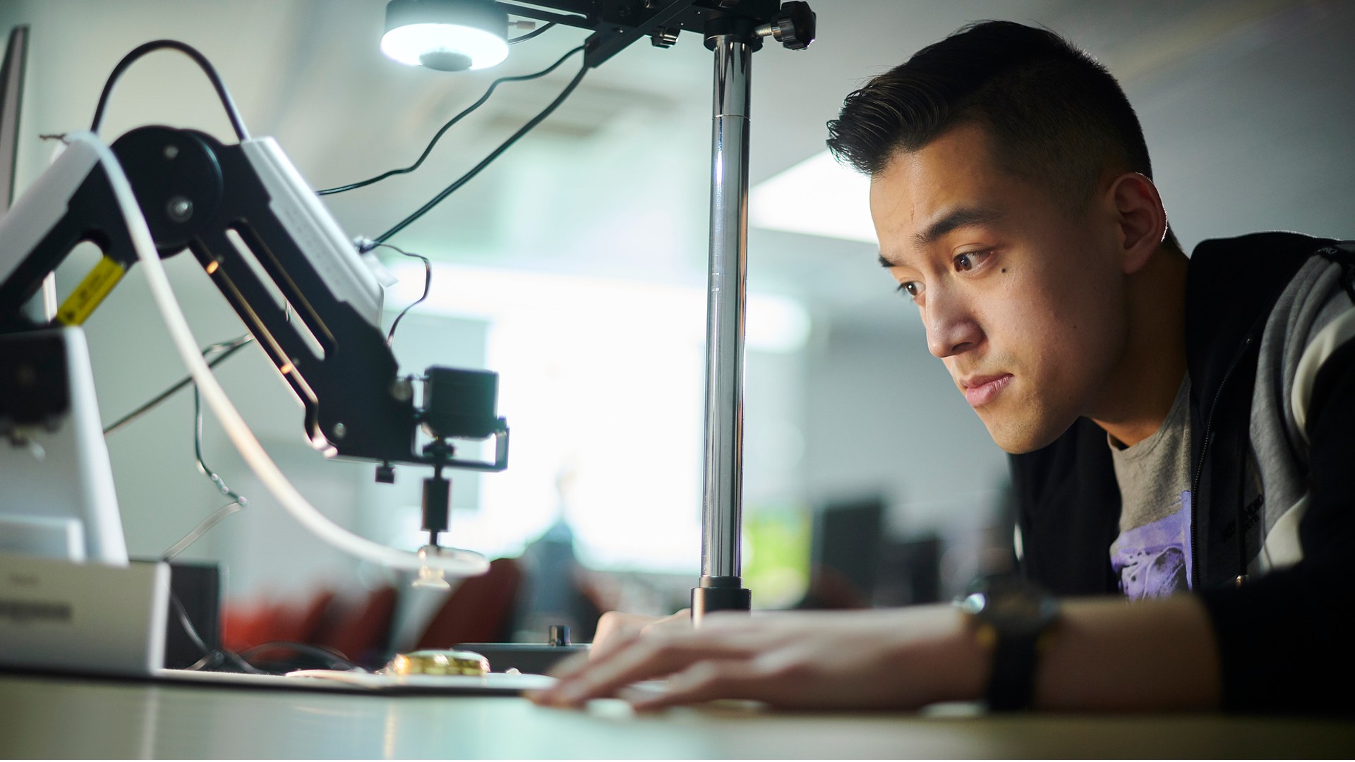 A computer science student using the technical equipment