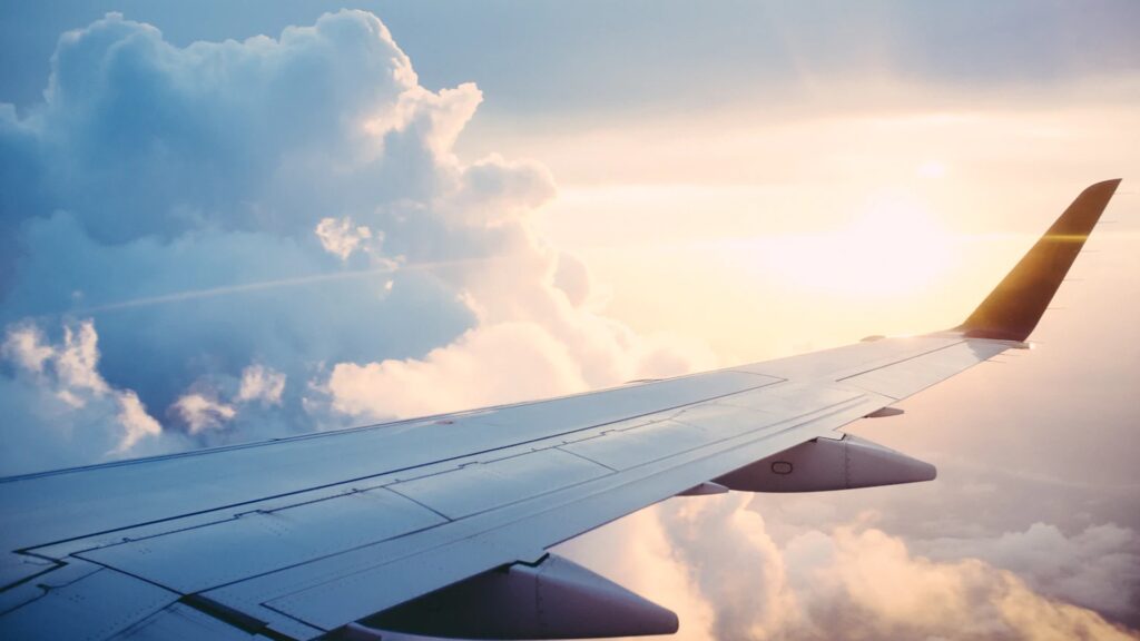 An aeroplane flying through the clouds.