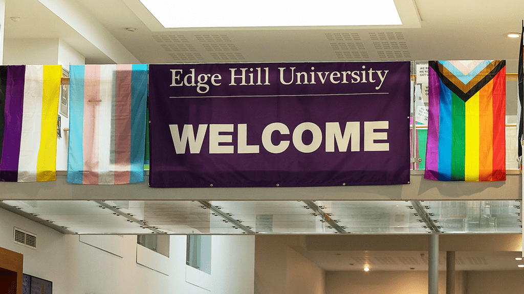 Edge Hill University welcome banner and pride flags in the Hub.