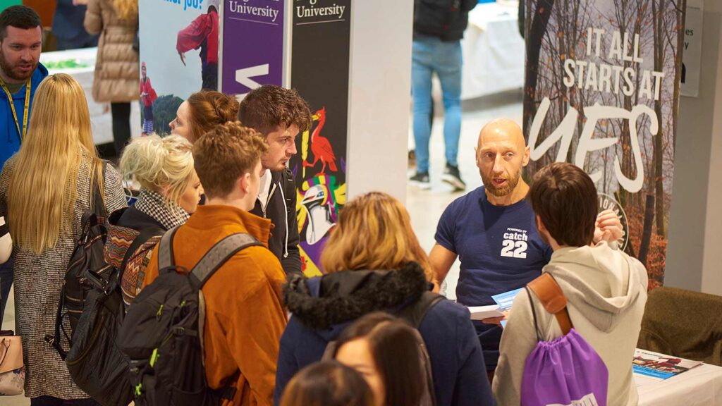 Students talking to an employer at a careers fair