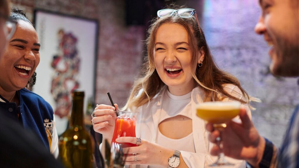 Students enjoy cocktails in a bar in ormskirk
