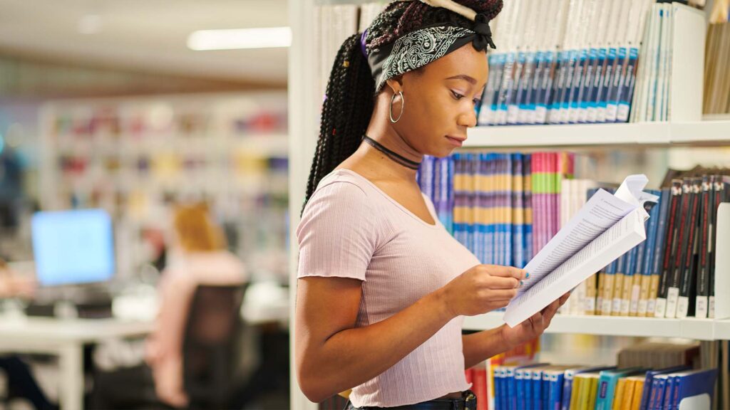 female student with a book in catalyst