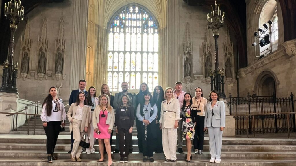Summer school participants with representatives from Edge Hill at Parliament.