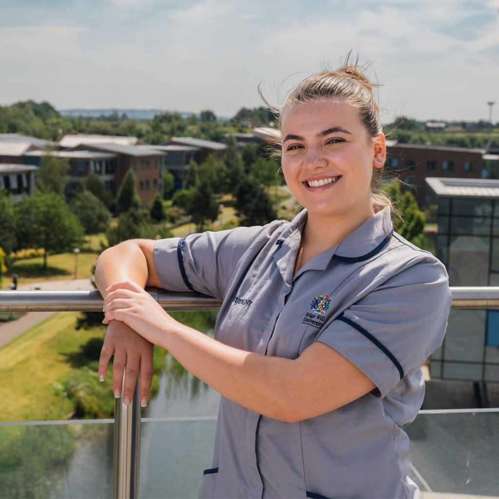 Image of medicine student, Lauren. Stood on rooftop garden in Catalyst building