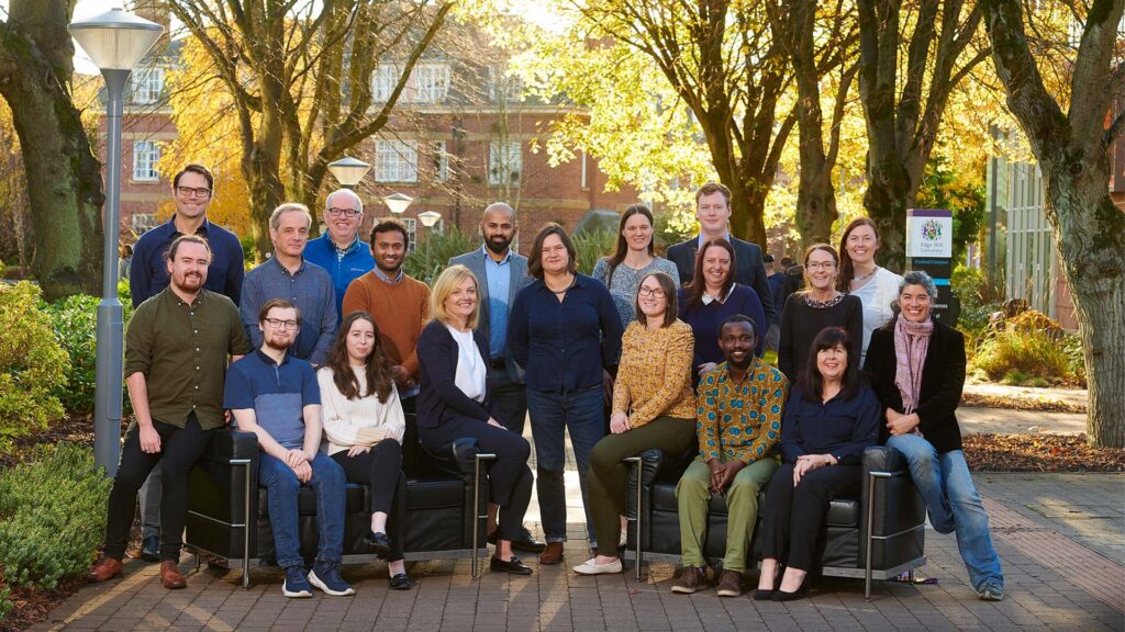 Geosciences staff sat outside the Law and Psychology building