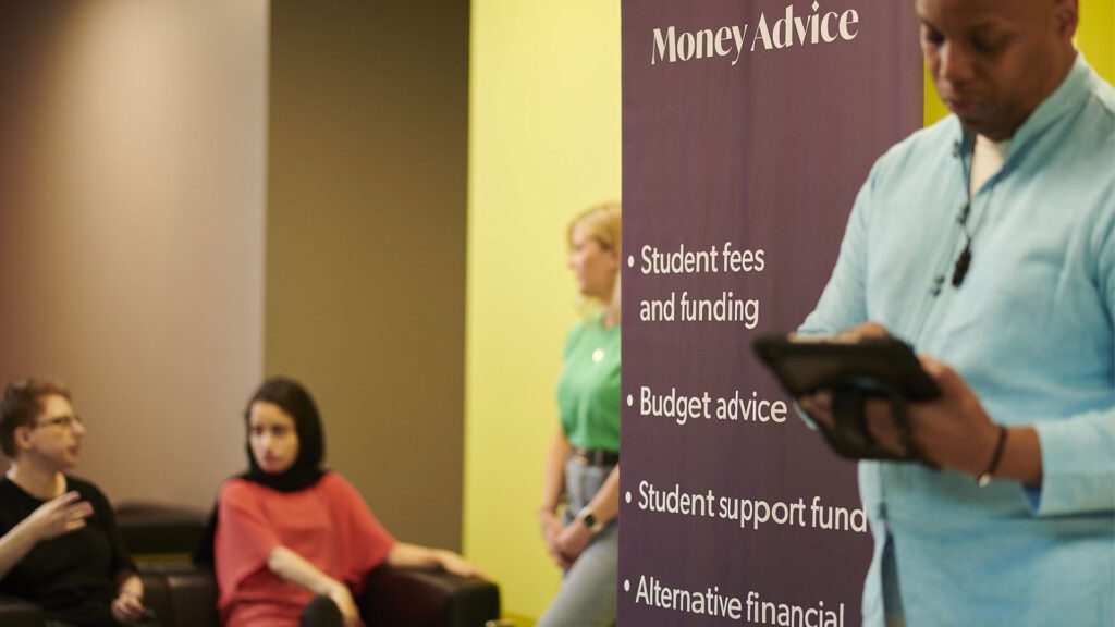 Staff from the Money Advice team chat to students waiting for their appointment