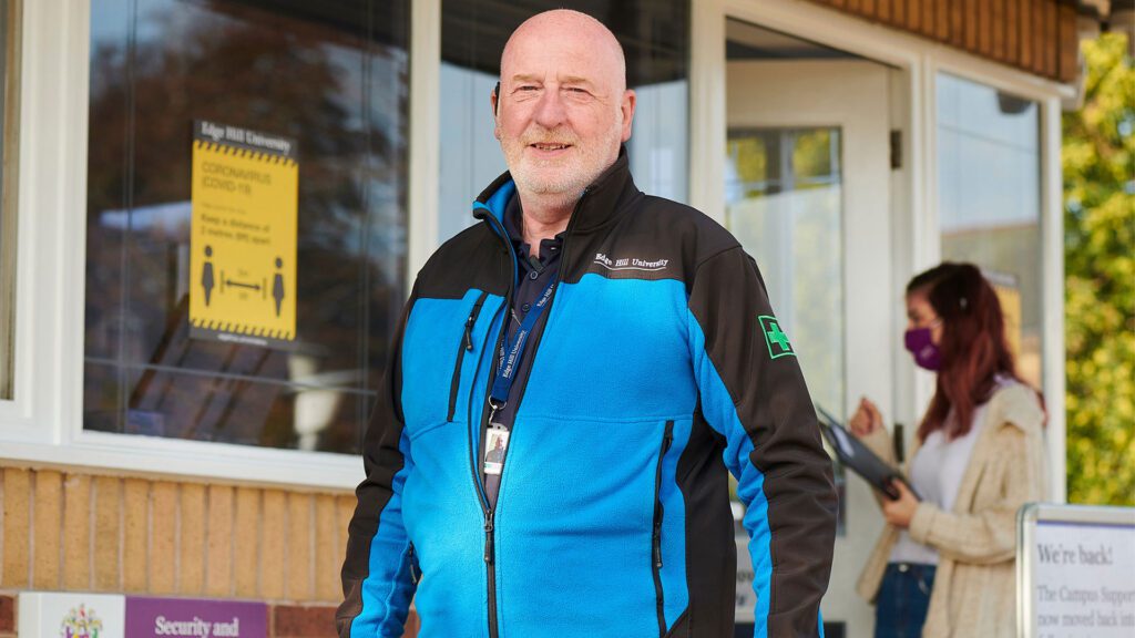 A member of security standing outside the Security and Customer Information Centre
