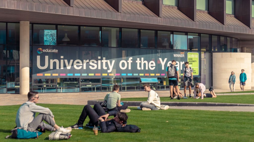 Students sit outside the Catalyst.