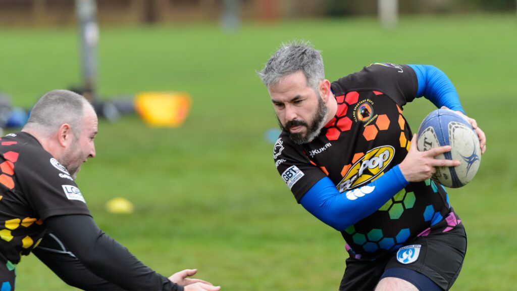 Two people playing rugby