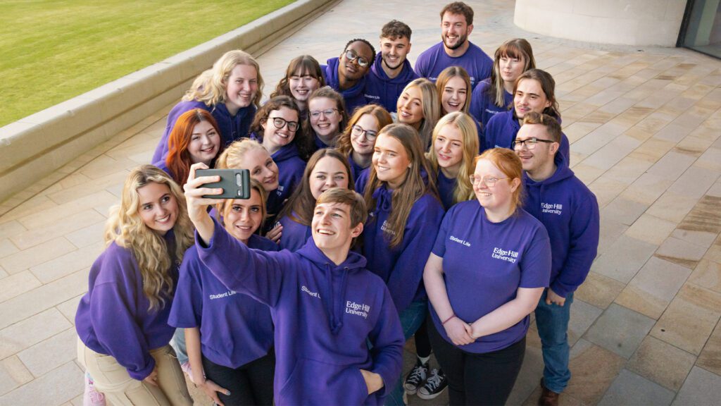 group shot of all the campus connectors taking a selfie outside catalyst