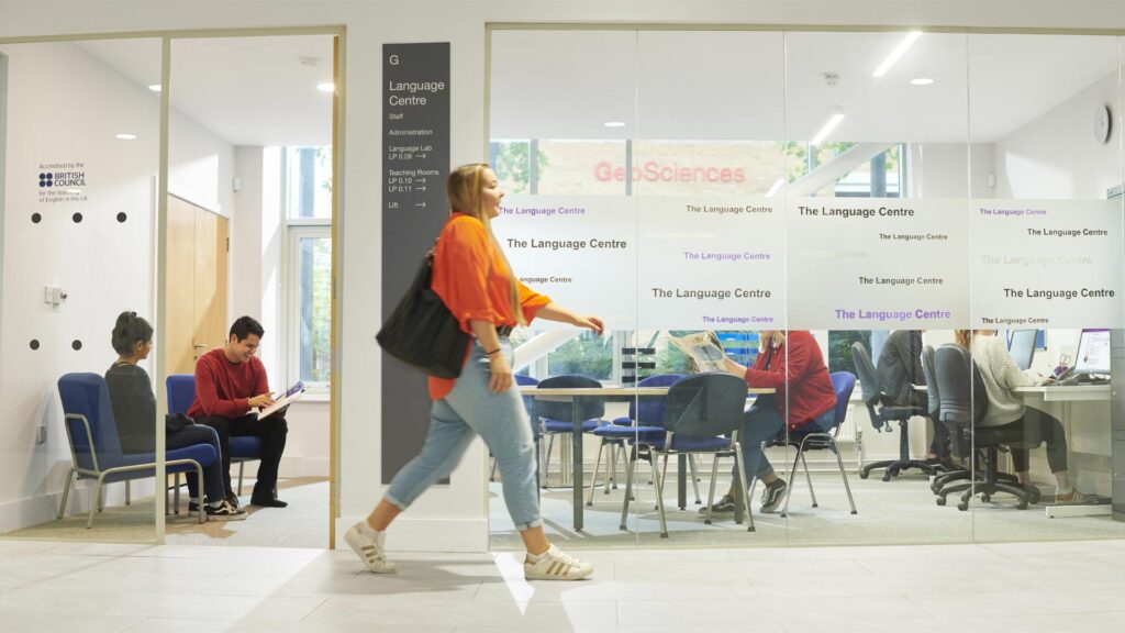 A student walks by the Language Centre in the Law and Psychology building