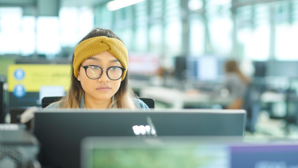 female student using computer in catalyst