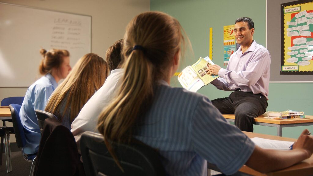 Teacher working with students in the classroom