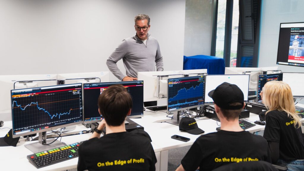 Students completing the Trading Challenge sat at a computer.