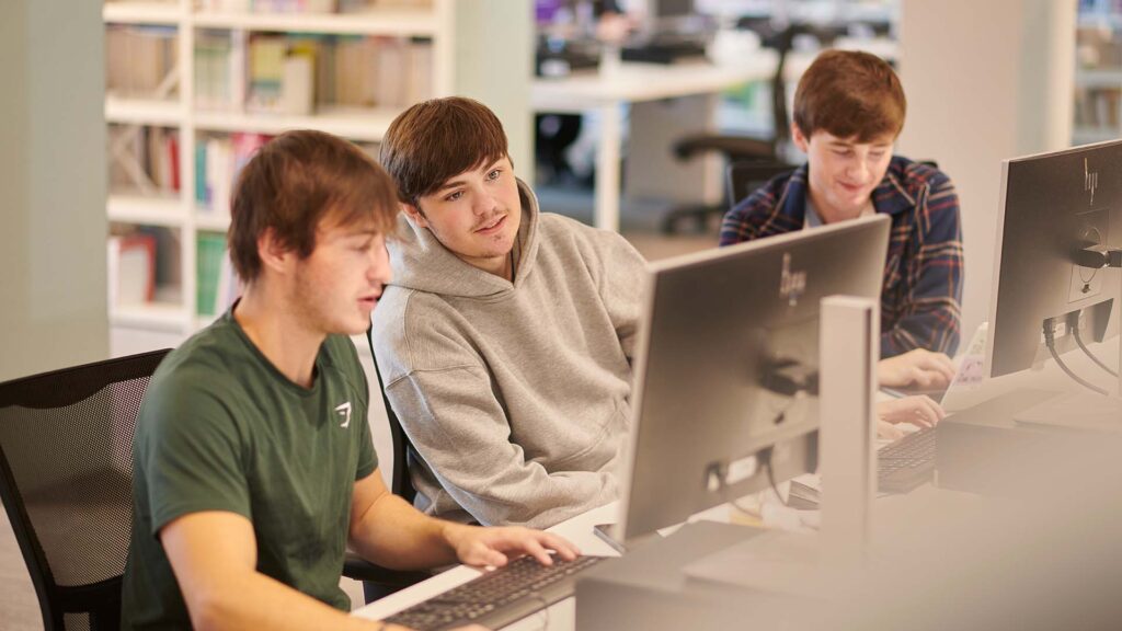 A group of students working at computers in our Catalyst building.
