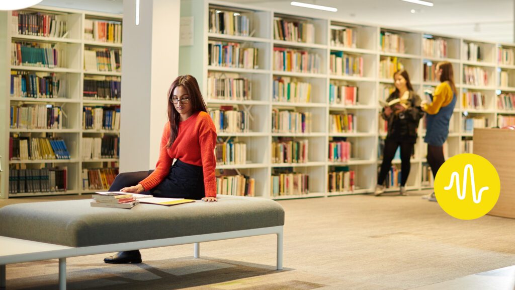 interior of Catalyst showing three students using the library facilities.