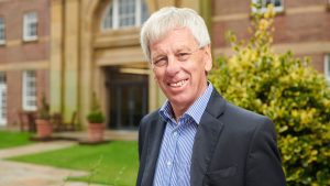 John Cater outside main building