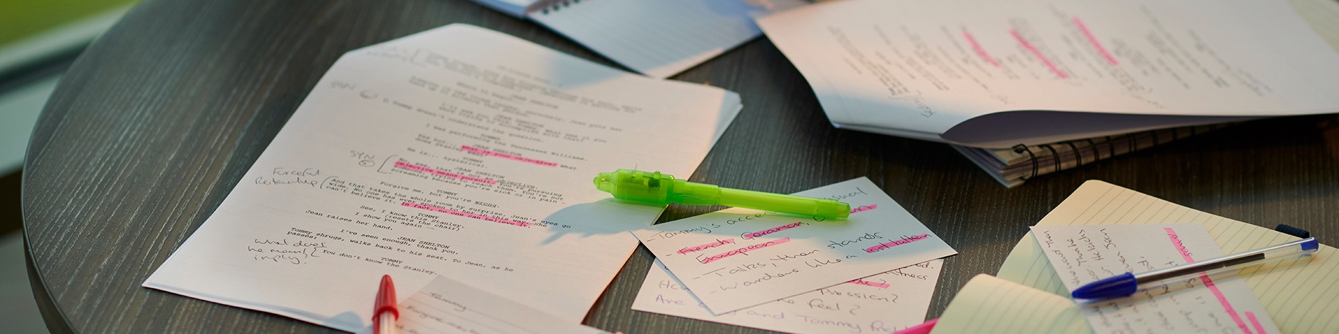 Pens and paper on a table