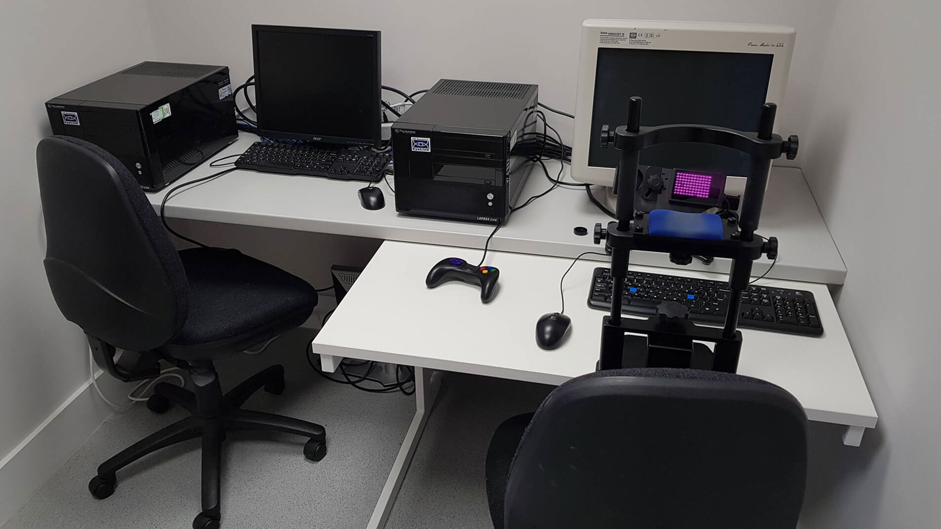 An eye tracking lab in the Psychology building. There are two desks with computers and software on them.