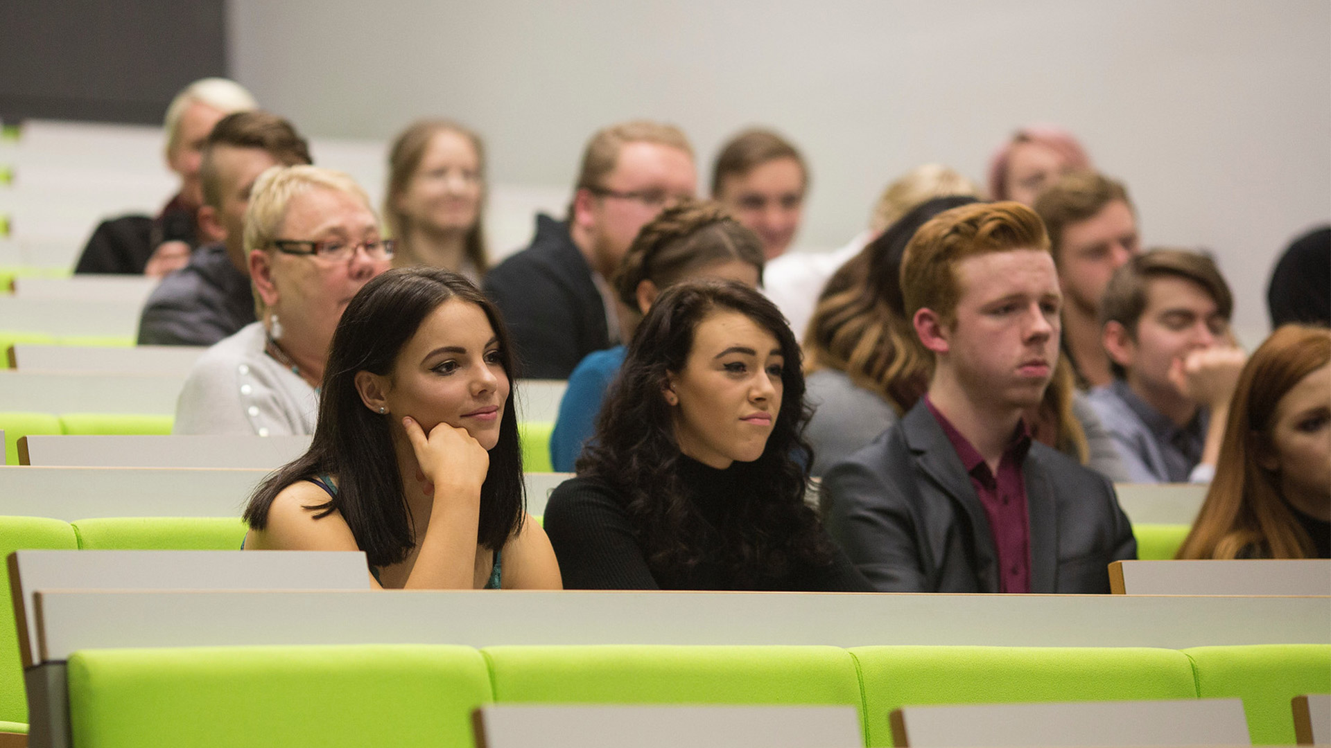 A row of students in a lecture theatre