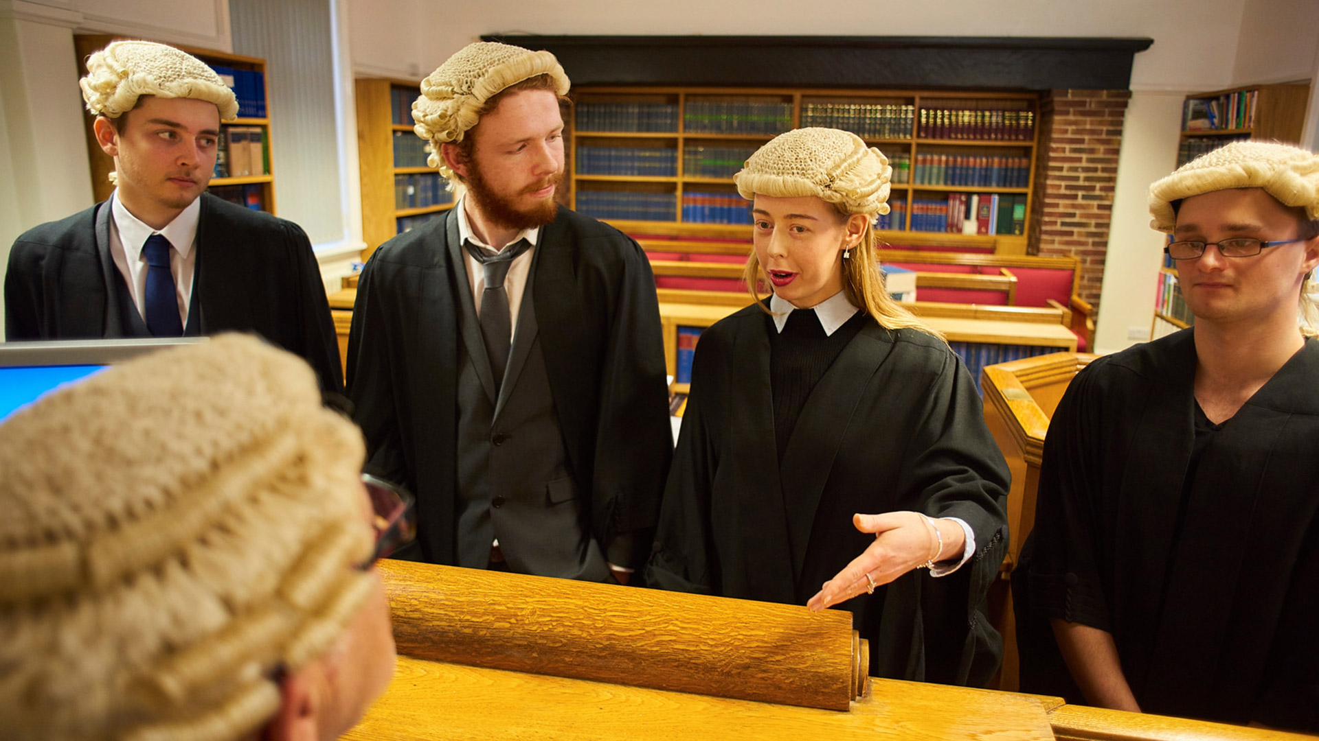 Law students in the mooting society mock courtroom