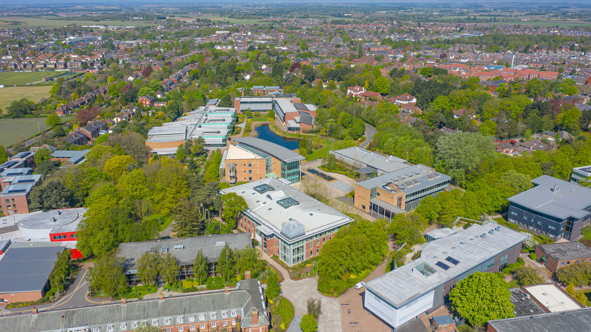 Aerial view of campus with the Law and Psychology building as the central focal point,