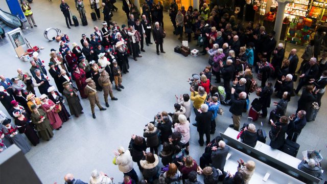 A performance at London St Pancras with an audience clapping