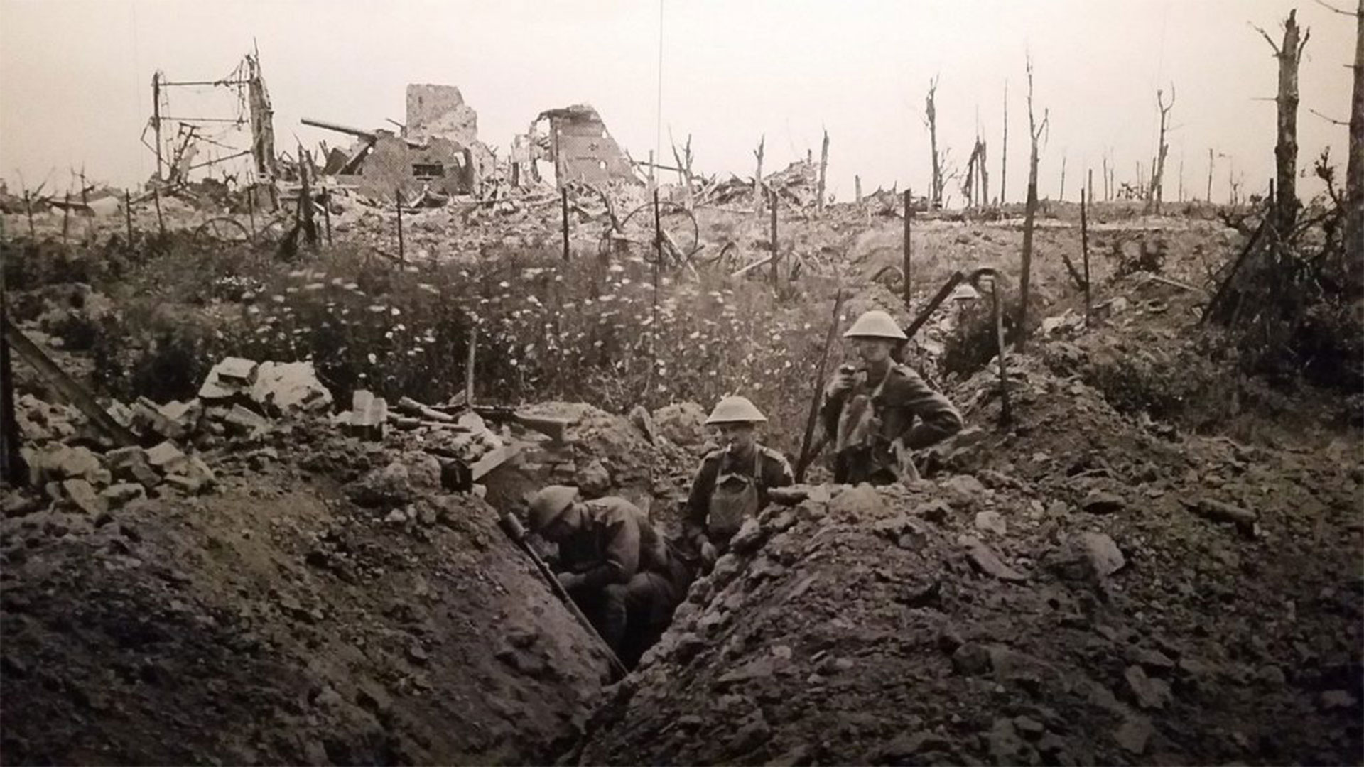 A black and white image showing the trenches of World War one