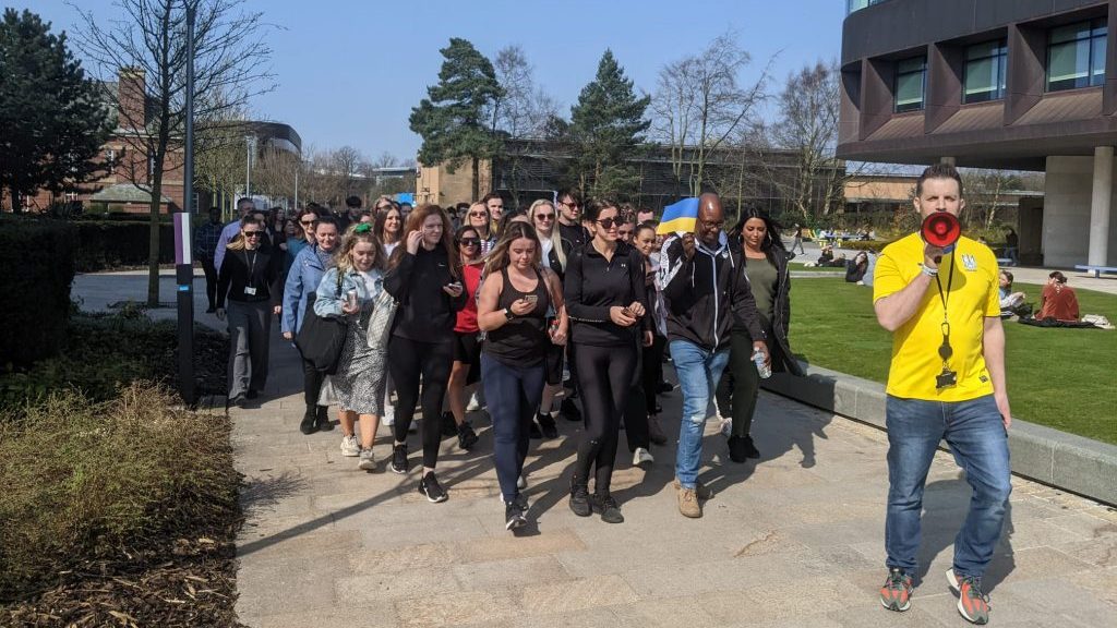 Edge Hill students and staff marching on campus