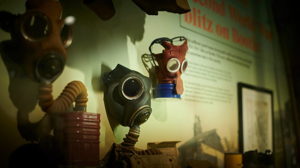 Gas masks hanging on a wall