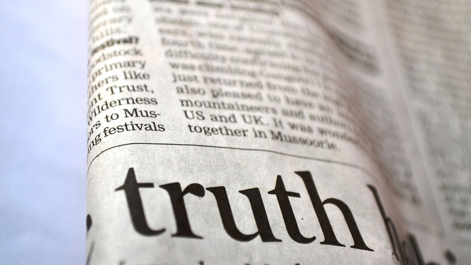 close up of a newspaper, highlighting the word 'truth'