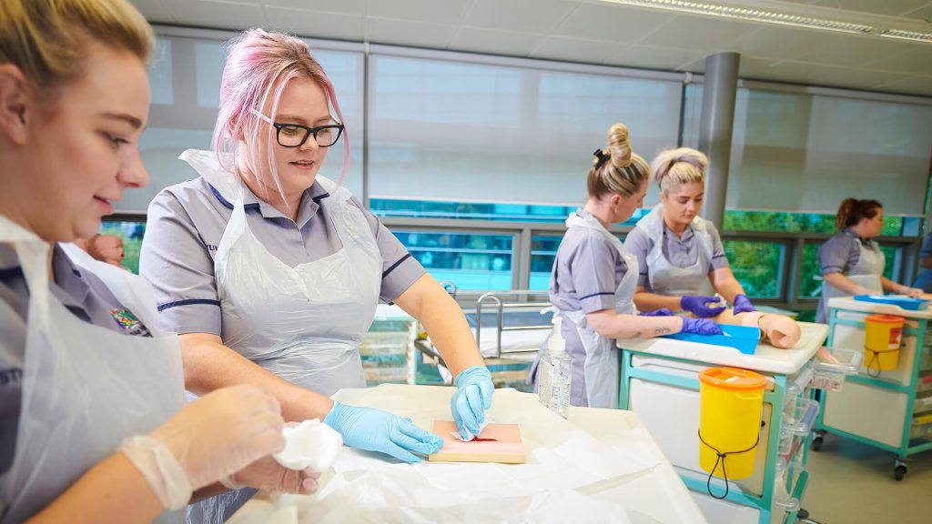 Student nurses practice performing injections in the Clinical Skills and Simulation Centre.