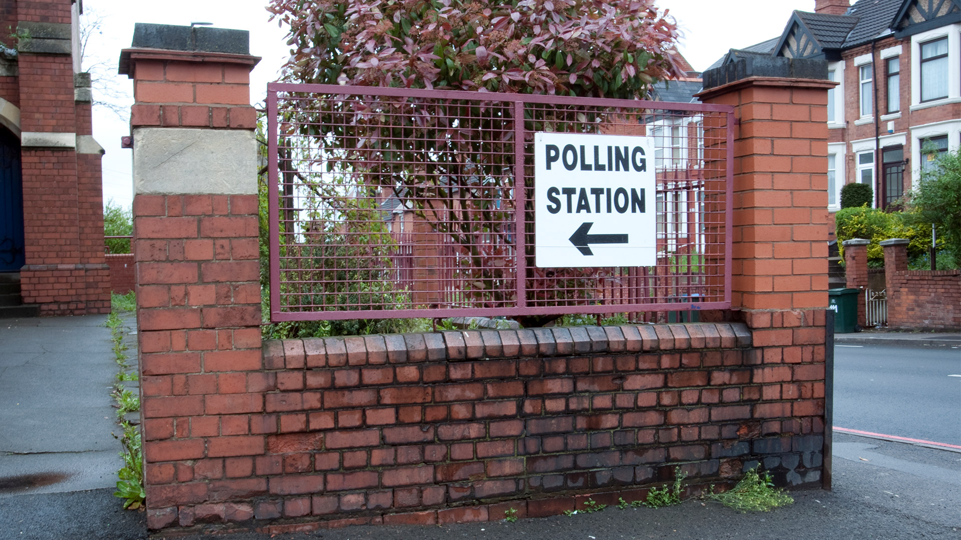 Polling station sign on building