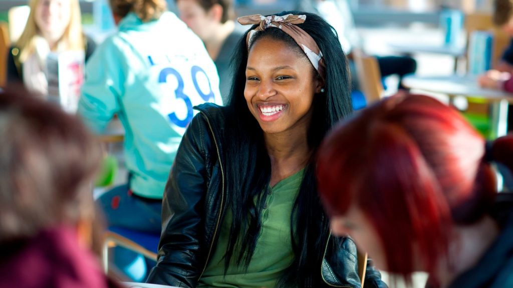 Students relax and chat in the Hub.