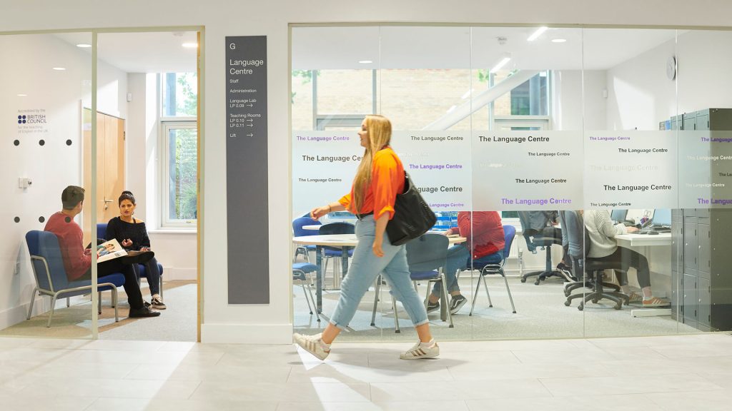 A student walks past the Language Centre in the Law and Psychology building.