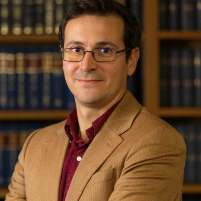A headshot of Andrea Cattaneo
