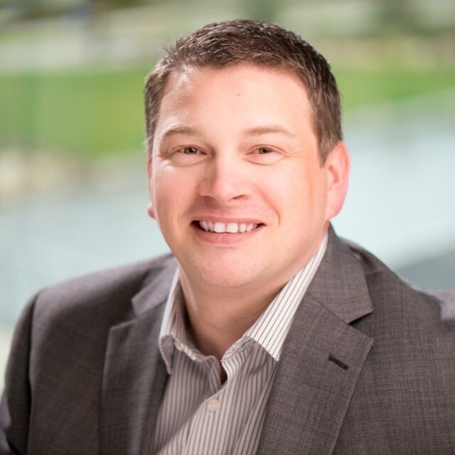 A headshot of David Walsh