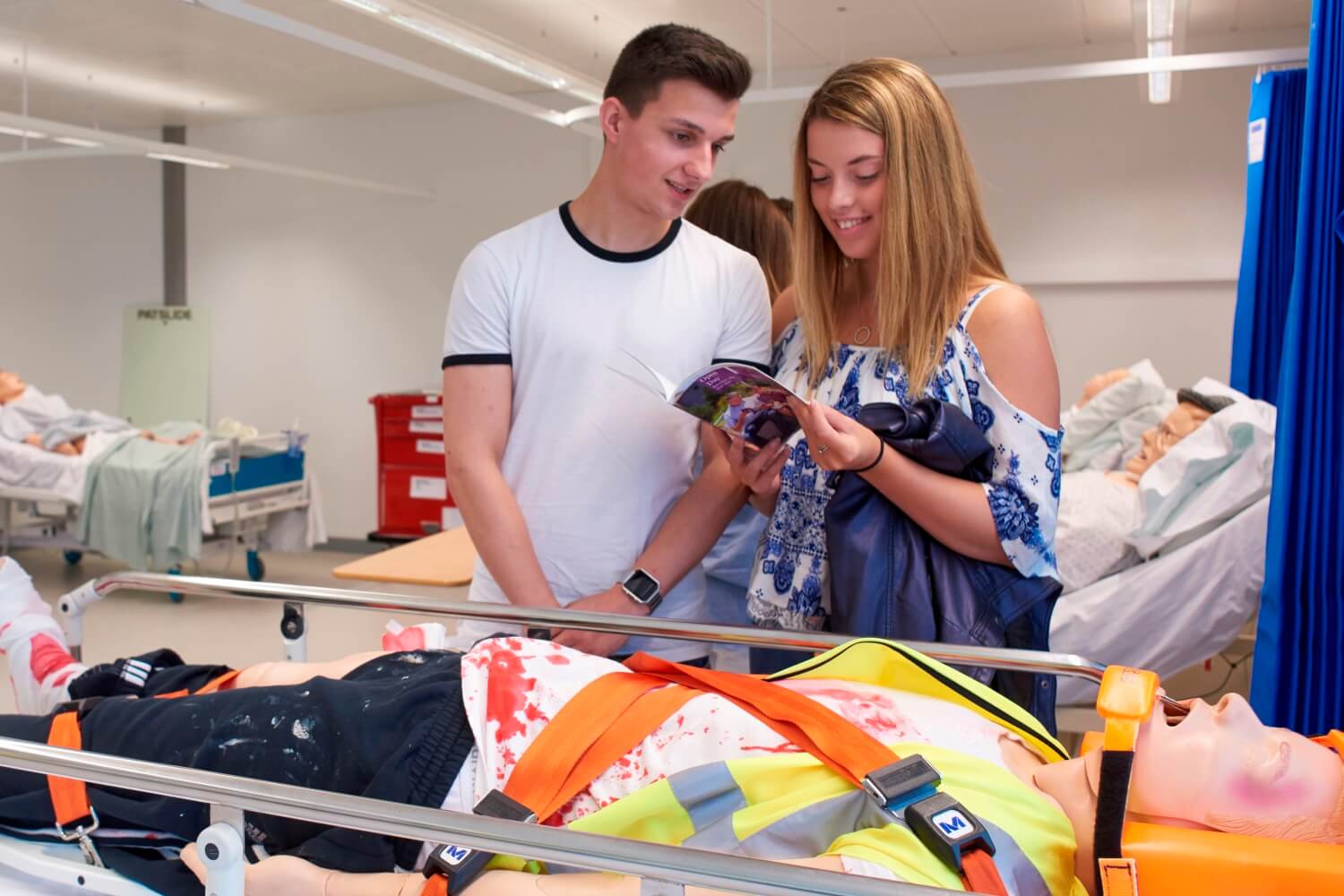 Prospective students view the clinical skills facilities in the Faculty of Health, Social Care and Medicine during an open event.