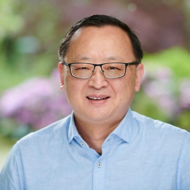 A headshot of Huaizhong Zhang