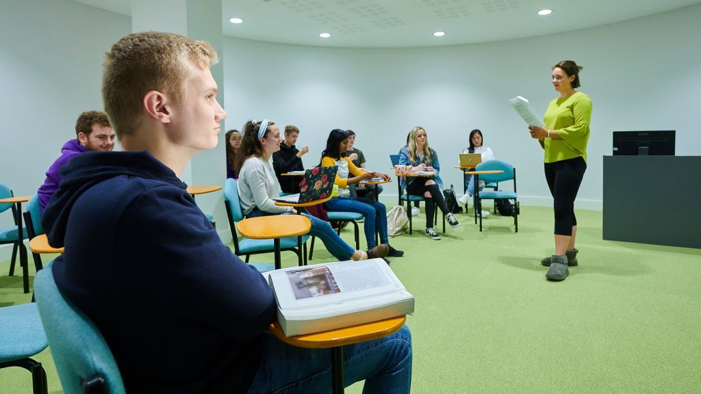 Students listen attentively during a lecture.