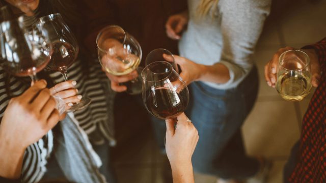 Women holding wine glasses