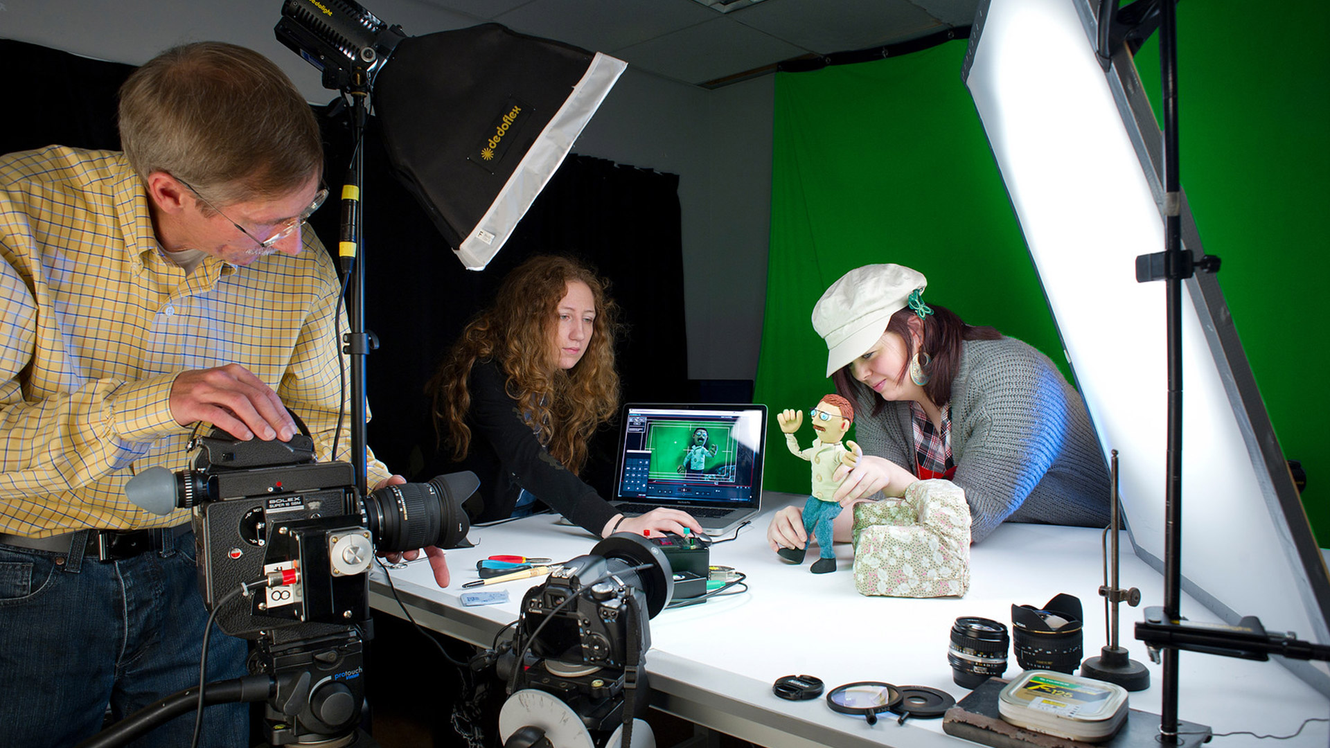 Animation students setting up a video of a clay model in the studio