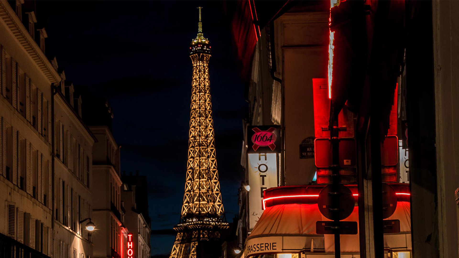 Paris at night looking at the Eiffel tower